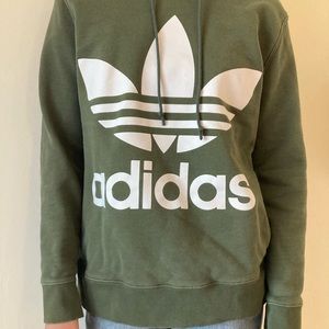 Women’s size medium green Adidas pullover hoodie.